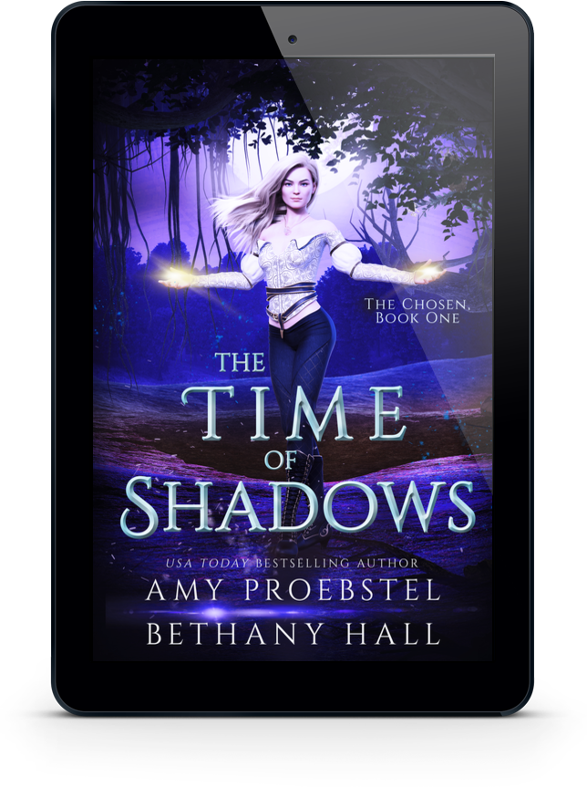 A black tablet device centered on a white background, displaying the book cover for 'The Time of Shadows' by Amy Proebstel and Bethany Hall. The cover art shows a woman standing in a purple-lit forest with glowing hands.