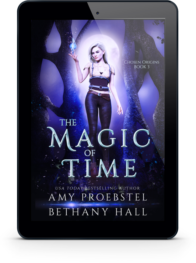 A black tablet device centered on a white background, displaying the book cover for 'The Magic of Time' by Amy Proebstel and Bethany Hall. The cover art shows a woman standing in a glowing blue-purple forest with large title text.