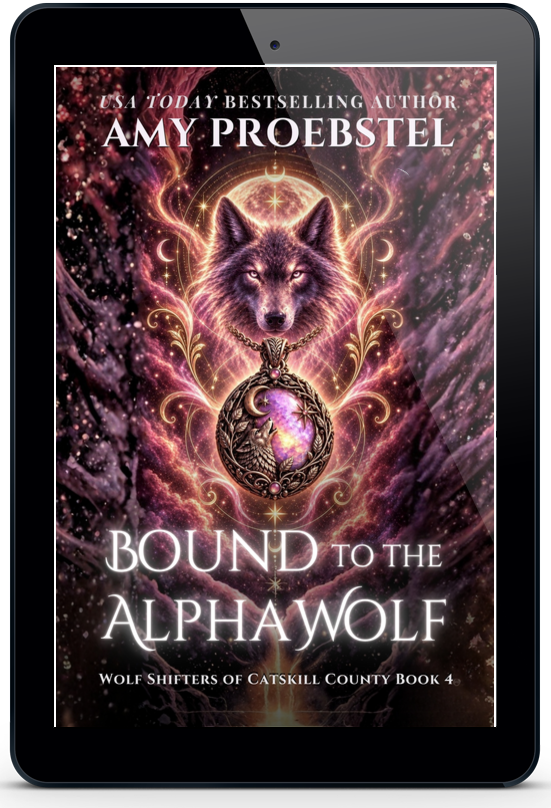 A black tablet device centered on a light gray background, displaying a book cover for 'Bound to the Alpha Wolf' by Amy Proebstel. The cover art features a glowing wolf and ornate purple, pink, and gold decorative details.