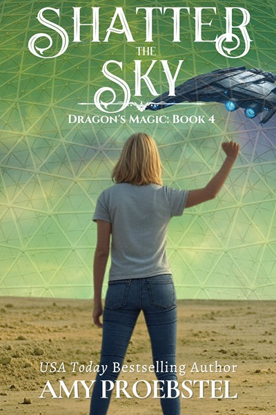 Book cover for 'Shatter the Sky: Dragon's Magic, Book 4' by Amy Proebstel, featuring a woman seen from behind in a desert landscape with a large dome structure and a spaceship in the sky.